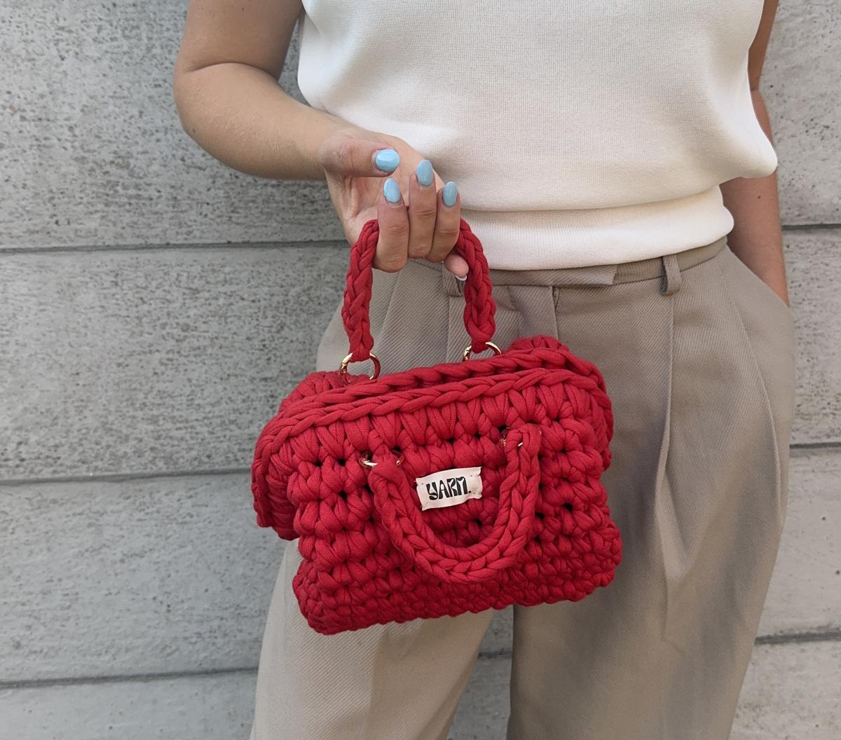 Cherry red crochet clutch by Yarn.