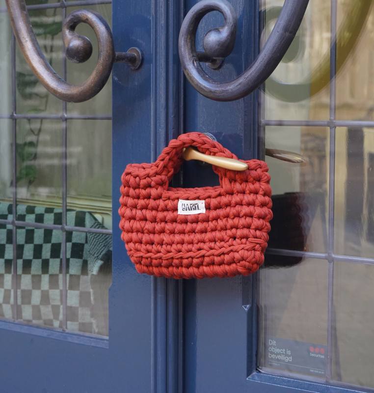 rust crochet bag by Yarn.